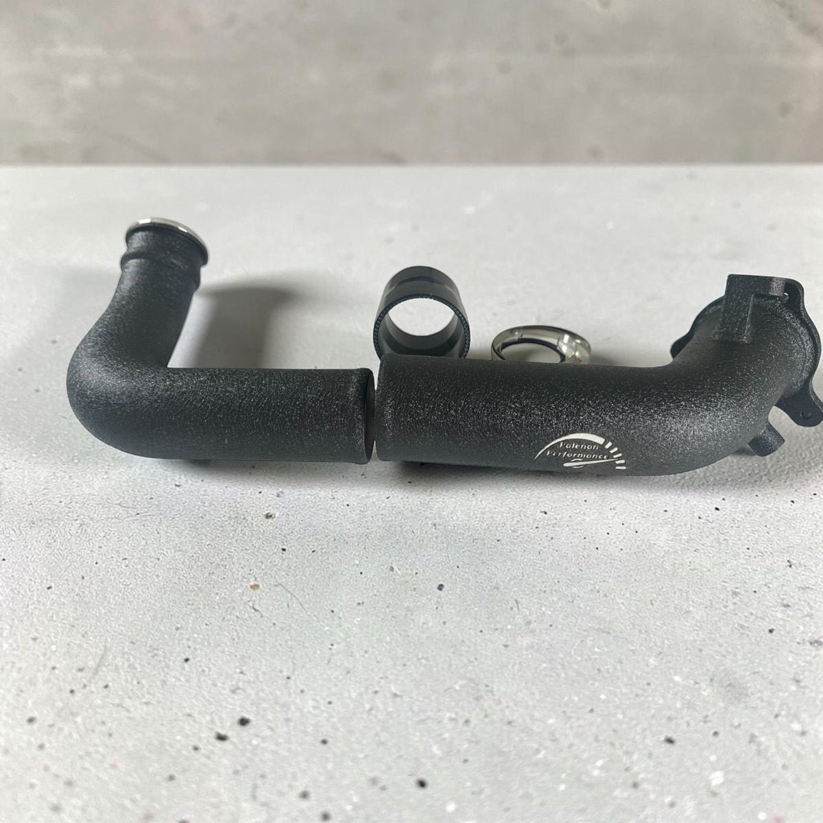 Palenon Performance B46 B48 charge pipe for BMW F & G chassis and Toyota Supra 2.0T, engine bay with polished metal pipe.
