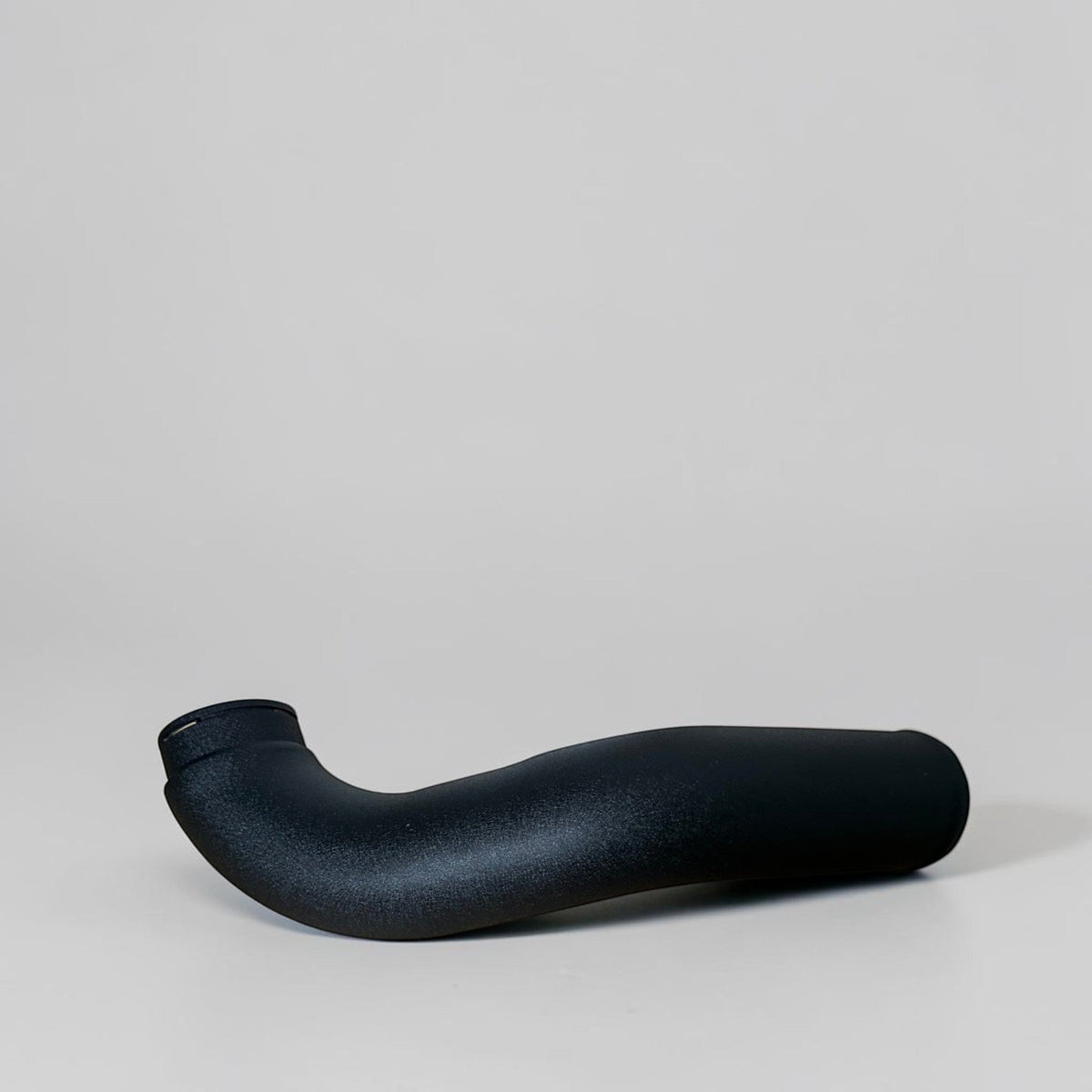 Palenon Performance B58 aluminum charge pipe for BMW and Toyota Supra, showcasing the polished, durable pipe with mounting connections.