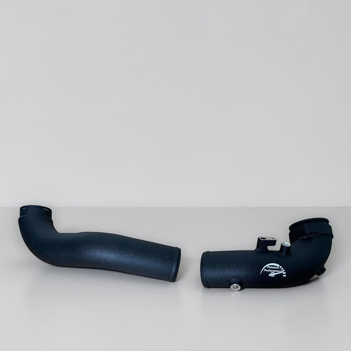 Palenon Performance B58 aluminum charge pipe for BMW Supra, M140i, M240i, M340i, X3, X4 models, close-up view of the pipe.