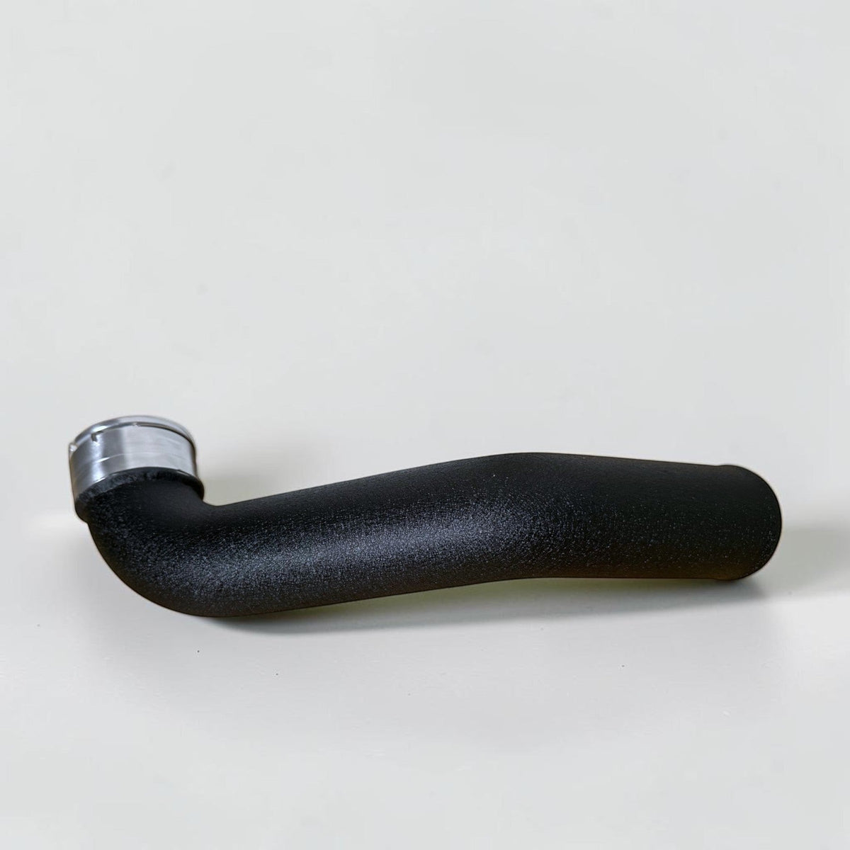 Black B58 charge pipe from Palenon Performance for BMW Supra, M140i, M240i, M340i, and X3 models, showing the polished metal finish.