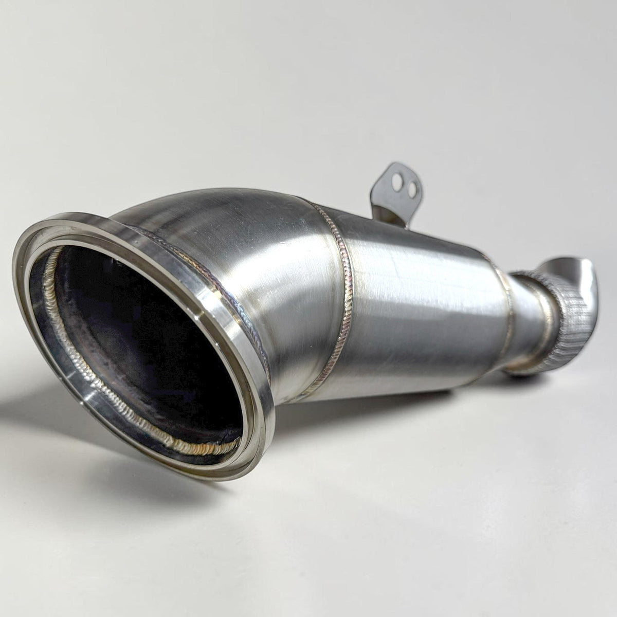 Palenon Performance B58 Racing Downpipe for BMW M340i, M440i, X5, X7, and other models, showing the exhaust pipe and fittings.
