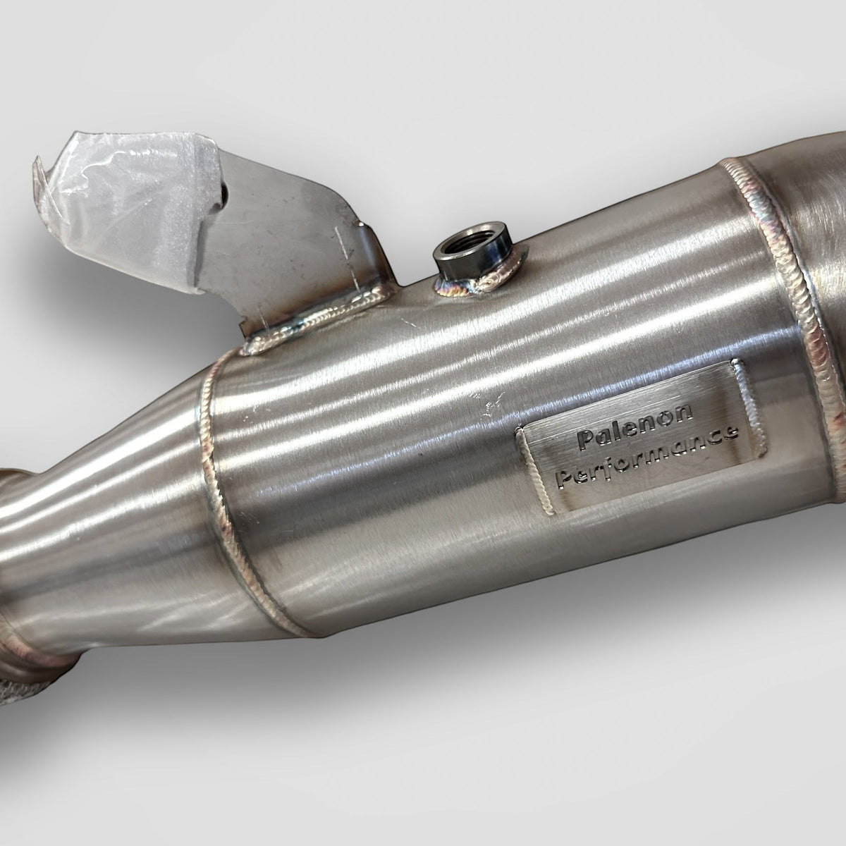 Palenon Performance B58 stainless steel racing downpipe for BMW M340i, M440i, X3, X5, and other BMW models, with polished finish.