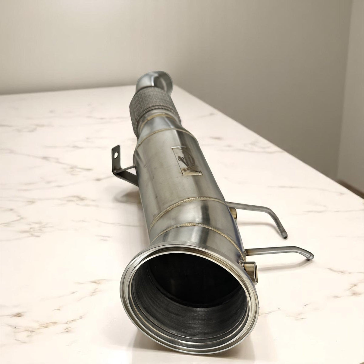 5-inch Gen 3 BMW B58TU2 racing downpipe by Palenon Performance, showing the stainless steel construction and flanged ends.