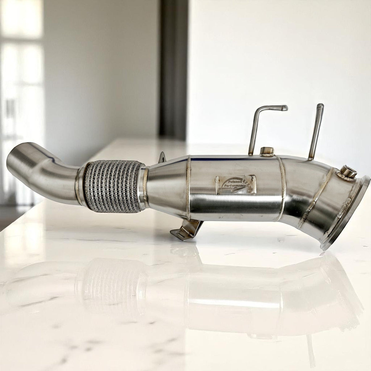 Palenon Performance 5-inch Gen 3 BMW B58TU2 racing downpipe with metallic finish for M340i, M440i, X5, X7 models.