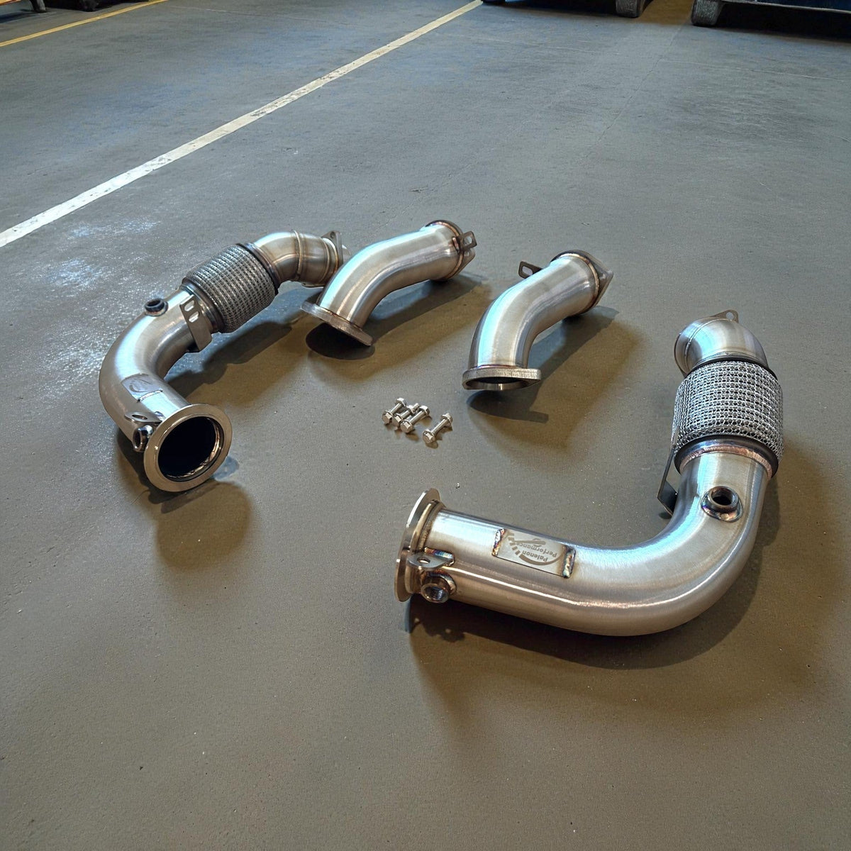 Palenon Performance S68 Racing Downpipes for BMW G90 M5 and G99 M5, showcasing high-performance exhaust components.