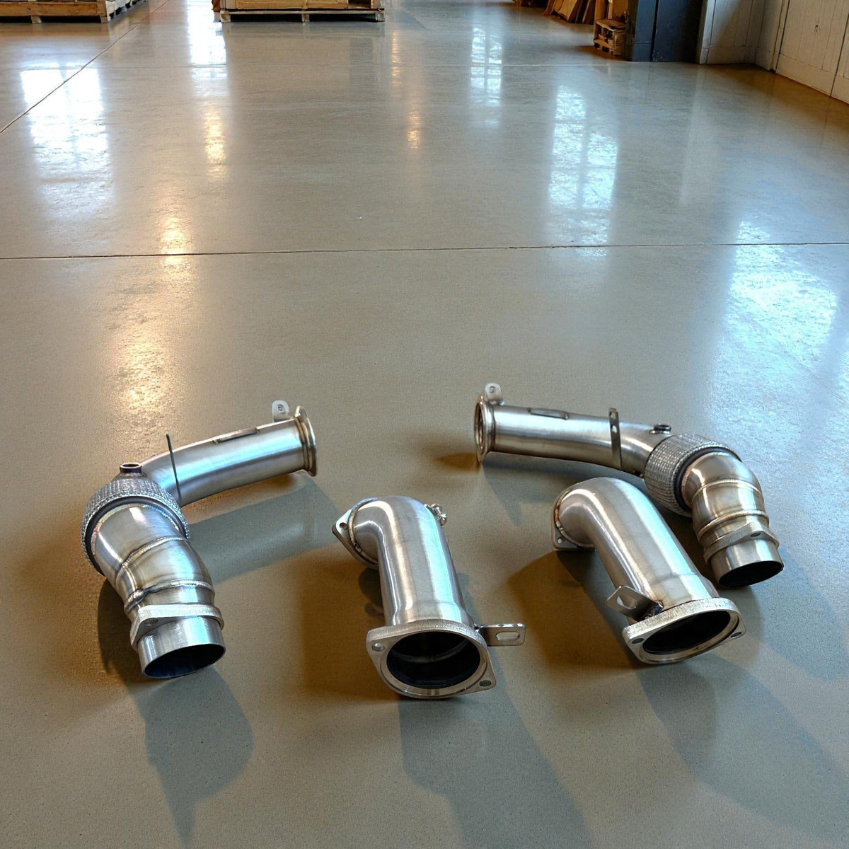 Palenon Performance S68 racing downpipes for BMW G90 G99 M5, stainless steel exhaust components with precise welds.