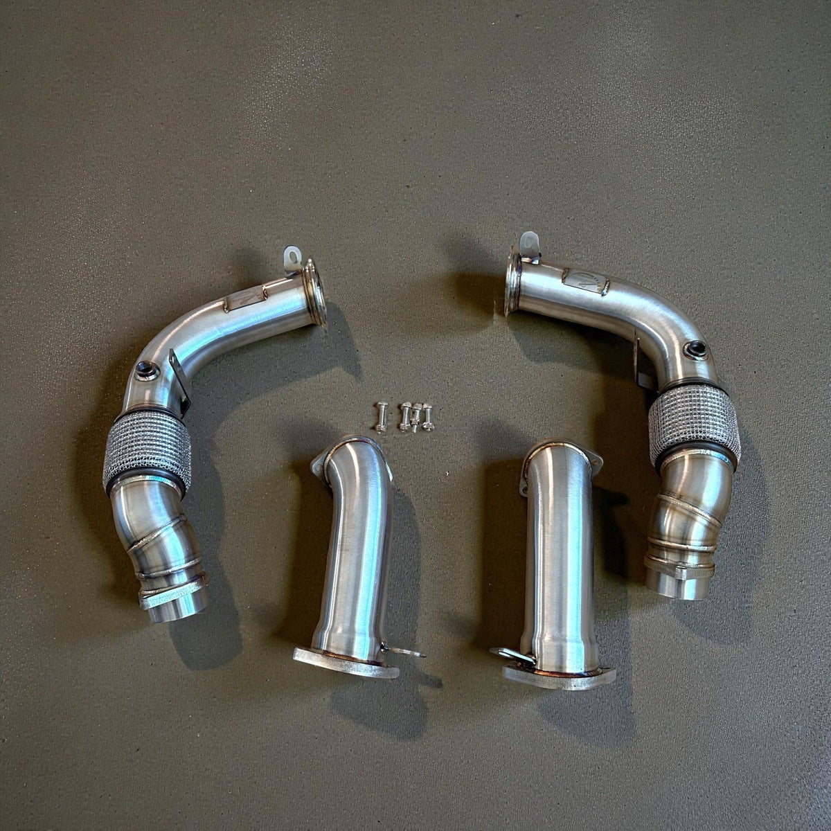 Palenon Performance S68 racing downpipes for BMW G90 and G99 M5, featuring high-performance stainless steel exhaust components.