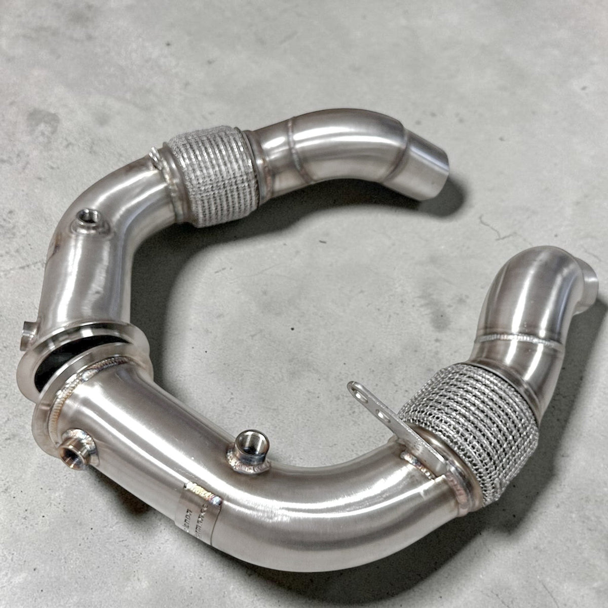 Palenon Performance stainless steel Race Downpipe for BMW F10 M5, F12 M6, F06, F13 M6 with S63 engine, showing polished exhaust pipe.