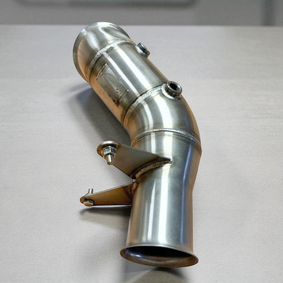 Stainless steel N55 racing downpipe by Palenon Performance for BMW 335i, 435i, M2, M135i, and M235i models.