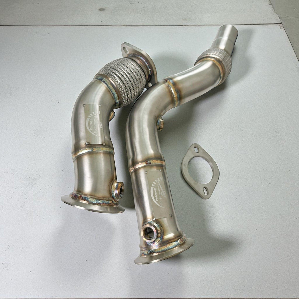 Palenon Performance S55 Racing Downpipe for BMW F80 M3, F82 M4, F87 M2 with polished stainless steel finish.