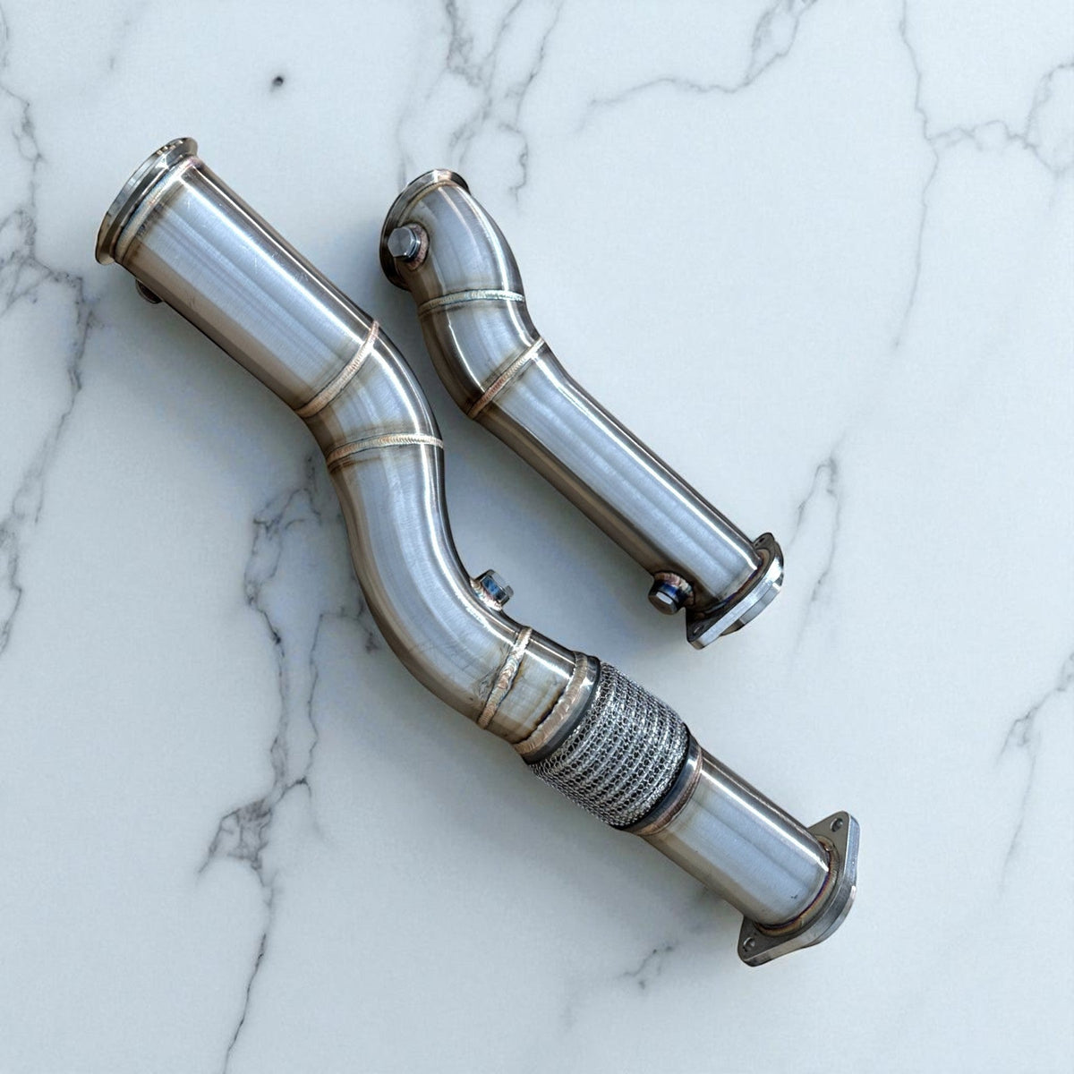 Stainless steel S58 race downpipe for BMW M3 G80, M2 G87, M4 G82 G83 from Palenon Performance, showcasing polished exhaust pipe details.