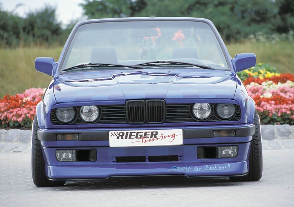 K2 Industries BMW E30 front splitter for Rieger front lip, made of durable material, enhances aerodynamic look of the vehicle.