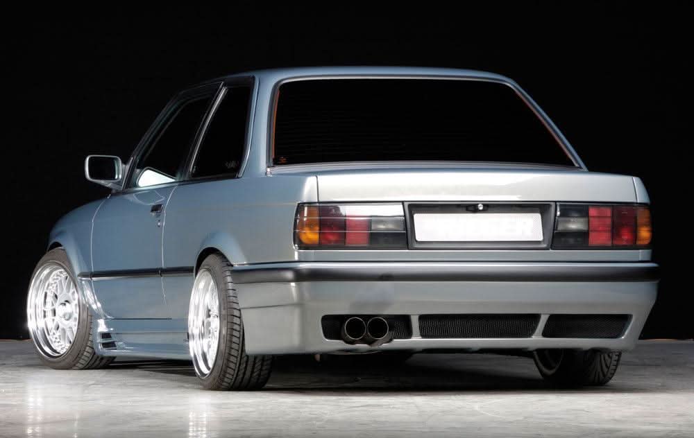 K2 Industries vented rear skirt extension for BMW E30 pre-facelift side skirts, showcasing the aerodynamic vented design.