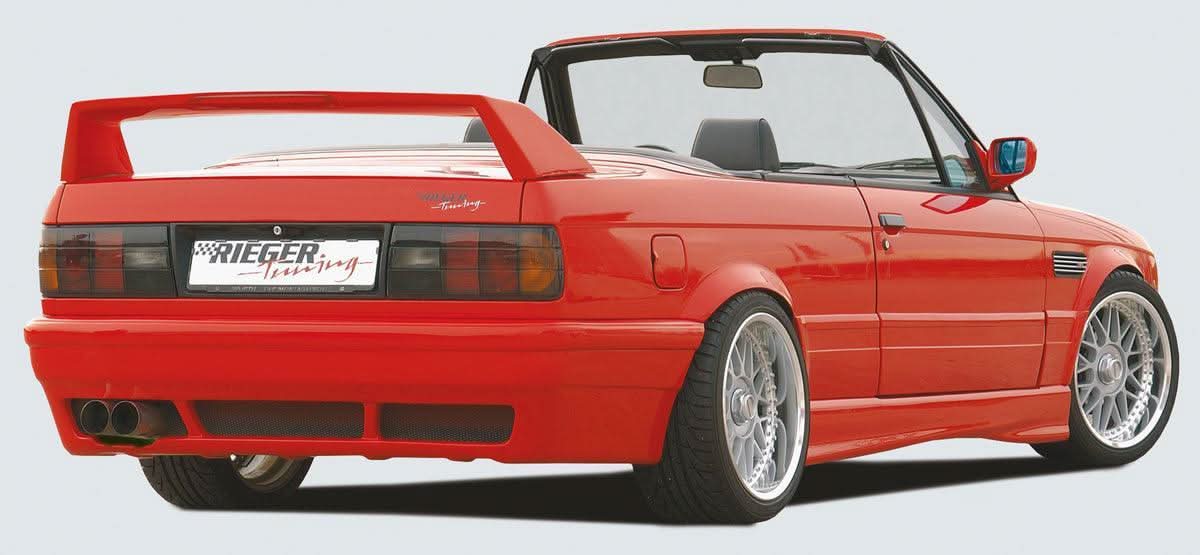 K2 Industries vented rear skirt extension for BMW E30 pre-facelift side skirts, enhancing rear styling and aerodynamics.