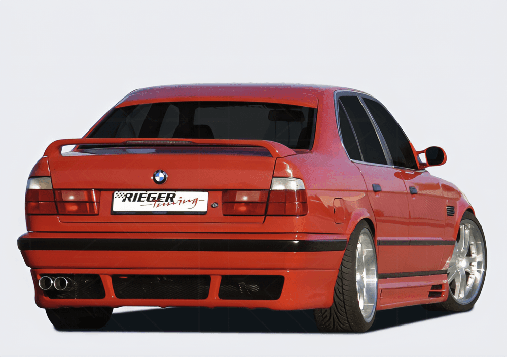 BMW E34 sedan and wagon vented rear apron with E39 look from K2 Industries, showing the textured vented design and fitment details.