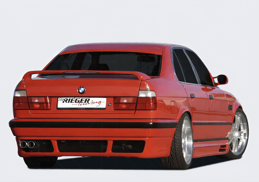 BMW E34 sedan and wagon vented rear apron with E39 look from K2 Industries, showing the textured vented design and fitment details.