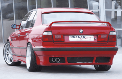 Vented rear apron for BMW E34 sedan and wagon, designed to resemble E39 style, by K2 Industries, shown on the vehicle.