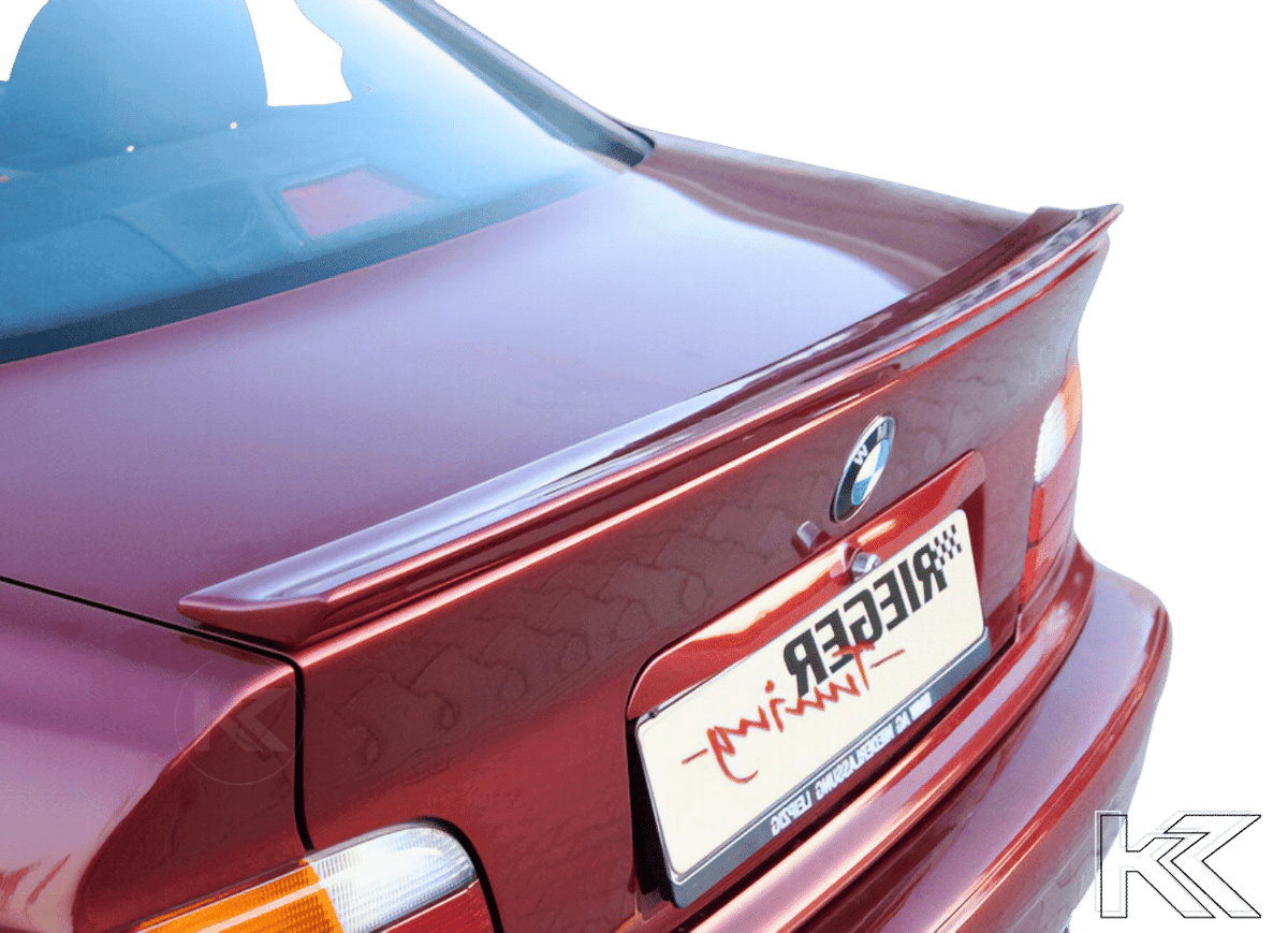 K2 Industries BMW E36 Coupe rear flap spoiler mounted on the car's trunk, enhancing aerodynamics and sporty appearance.