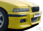 K2 Industries BMW E36 front bumper in E46 style, showing the sleek black plastic bumper with mounting points and aerodynamic design