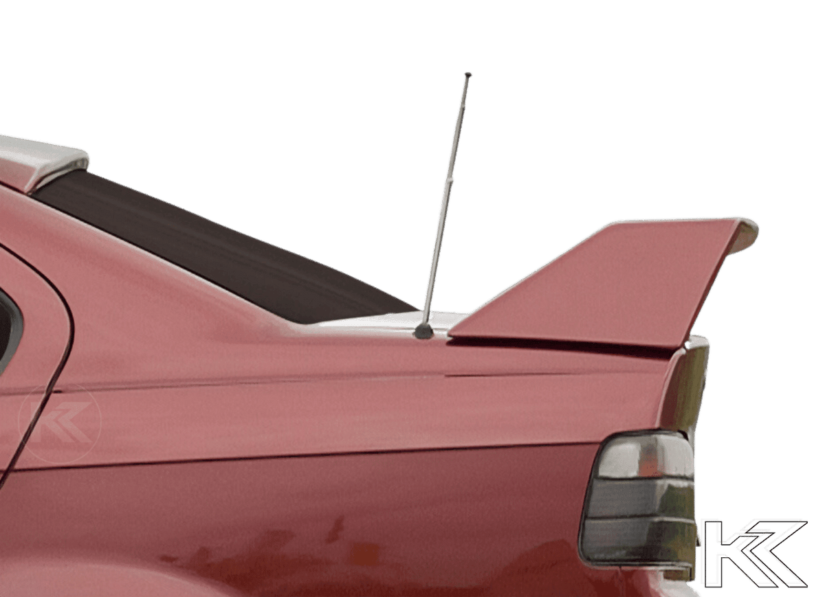 K2 Industries BMW E36 Sedan GT Wing spoiler without third brake light, black aerodynamic car accessory on the vehicle.