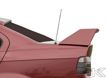 K2 Industries BMW E36 Sedan GT Wing spoiler without third brake light, black aerodynamic car accessory on the vehicle.