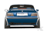 Vented rear bumper for BMW E36 by Rieger, made by K2 Industries, showing the black bumper with vented design and mounting points.