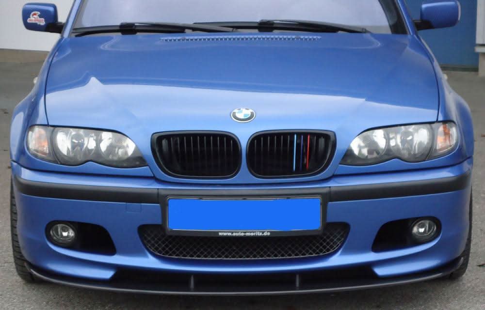 Carbon fiber front lip for BMW E46/Z4 M-Technic by K2 Industries, showcasing its sleek design and textured finish.