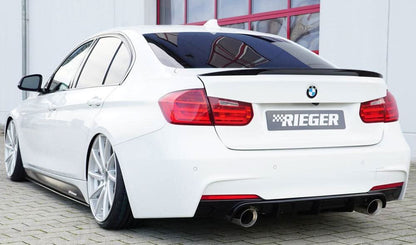 K2 Industries BMW F30/31 M Technic side skirt insert for rear skirt, black aerodynamic car accessory on vehicle side.