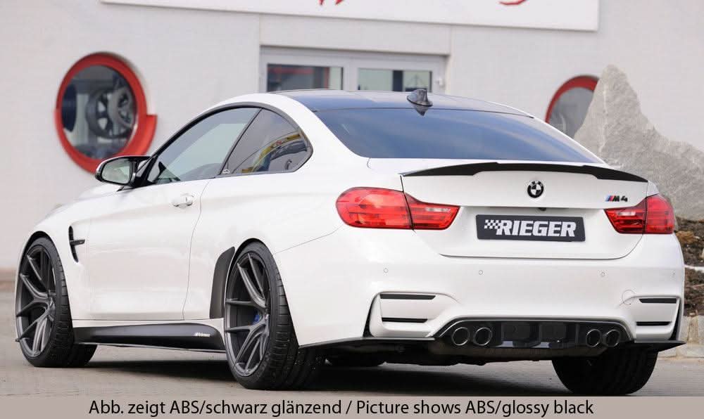 K2 Industries BMW F82 M4 rear skirt insert side skirt shown from side angle on black car.
