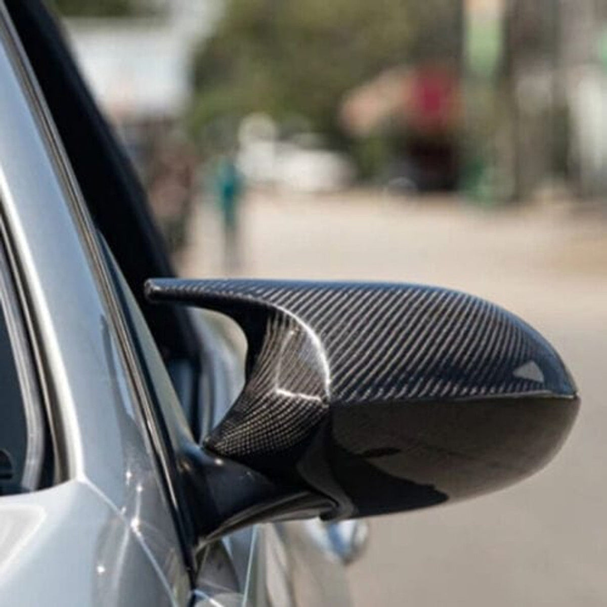 Carbon fiber M style mirror caps for BMW E92/E93 328i, 335i, 335is by Palenon Performance, showing sleek exterior mirror covers.