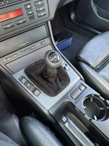 Black genuine suede shift and parking brake boot cover for BMW E36 3 Series (1991-2005), by JTS Custom Upholstery.