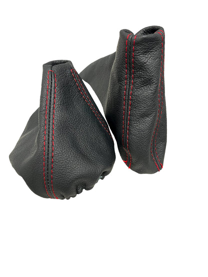 Black genuine leather shift and handbrake boot cover for BMW E91, E92, E93 from JTS Custom Upholstery, featuring red accents in the image.
