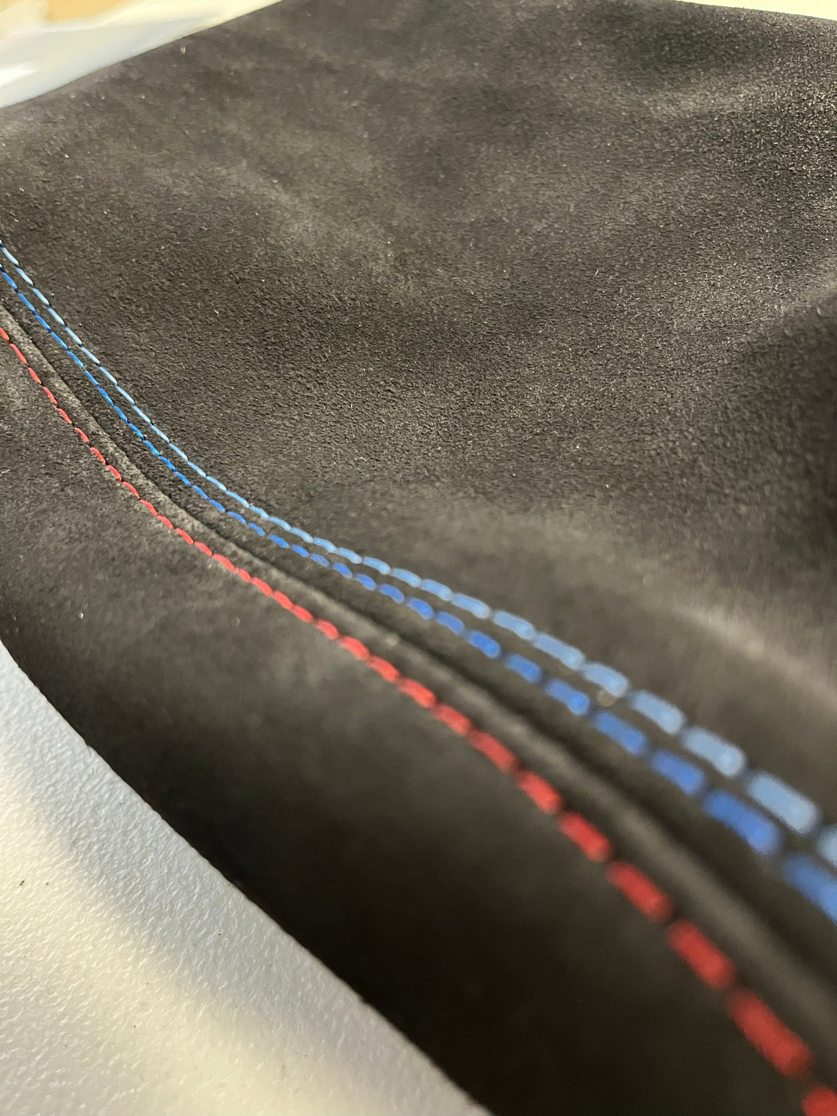 Genuine suede BMW E36 parking brake shift boot and console cover in M stitch, designed for 1991-2005 models.
