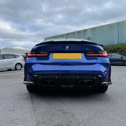 BMW G80 M3 and G20 V Style carbon fiber trunk spoiler, aerodynamic design, enhances sporty look and performance.
